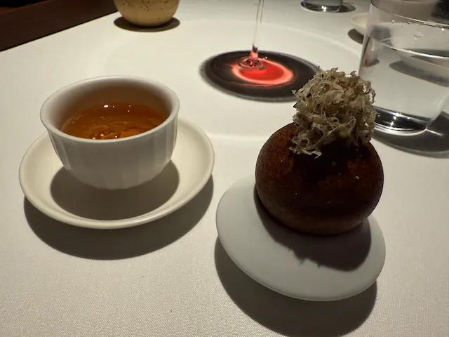 broth and savory beignet